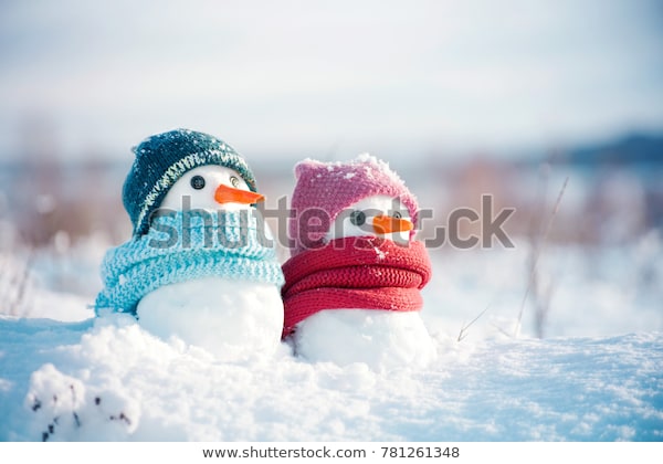 Photo of 2 snowmen in snow.