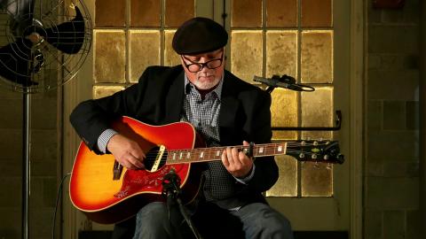 Tal Naccarato playing guitar